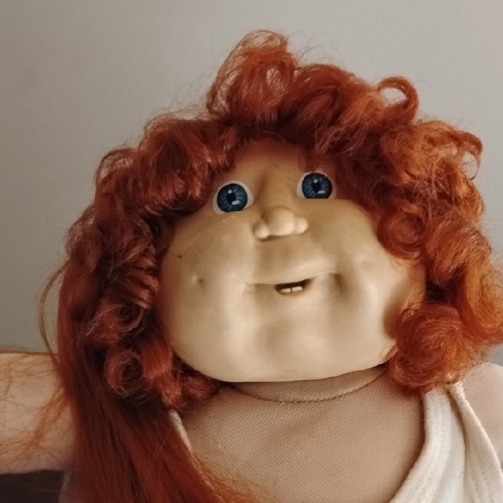Adorable Red-Haired Doll with Blue Eyes